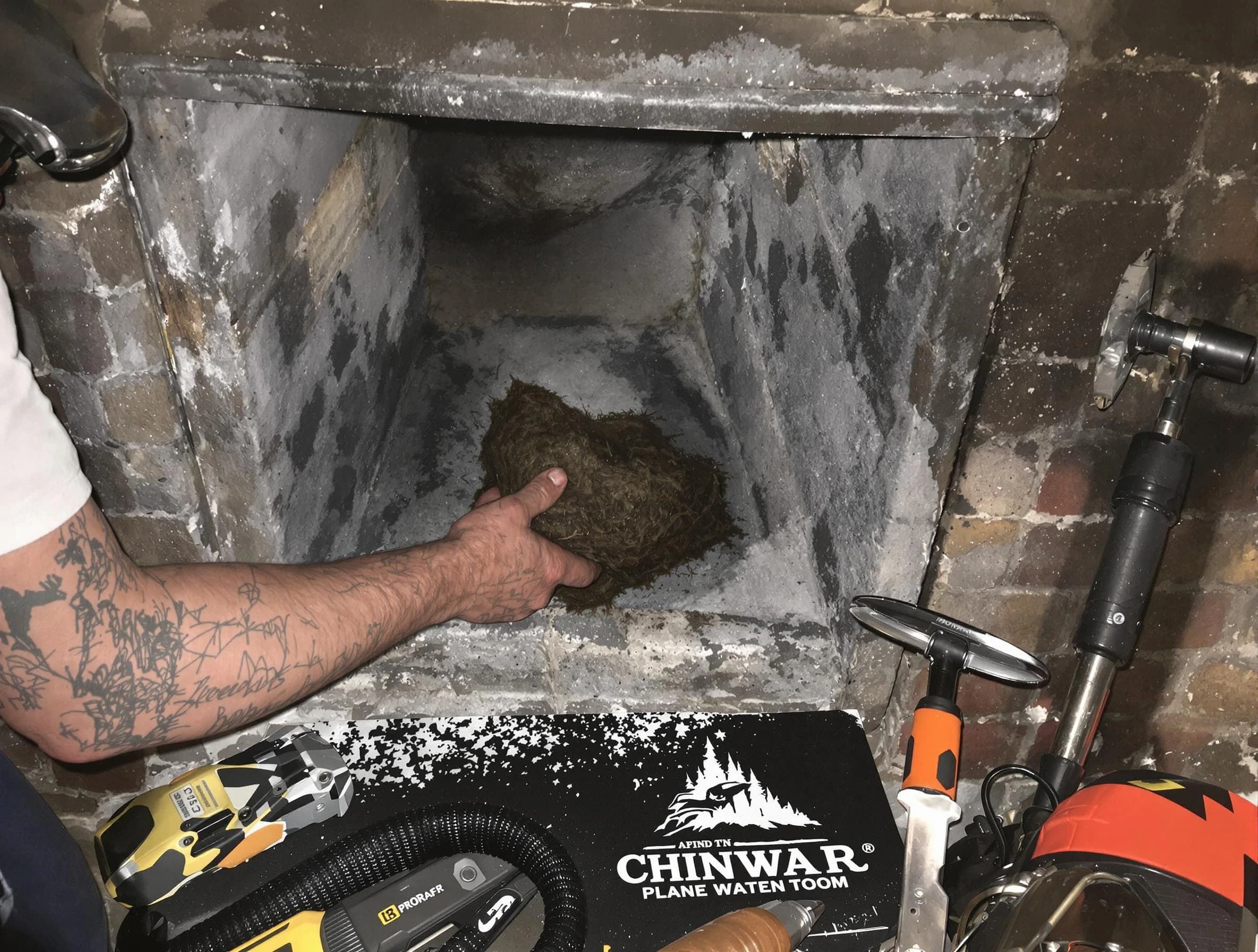 South Weber Chimney Sweep safely removing debris and screening chimney in South Weber, UT